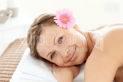 Portrait of a cute woman having a flower