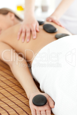 Close-up of a bright woman relaxing on a massage table