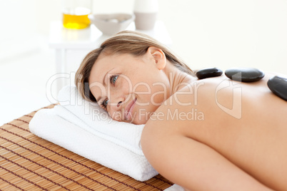 Cute woman relaxing on a massage table