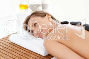 Cute woman relaxing on a massage table