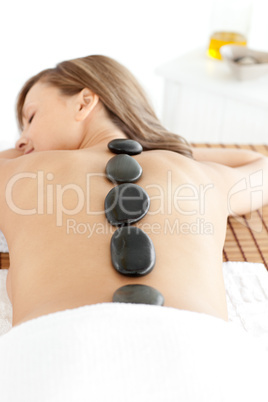 Happy woman lying on a massage table
