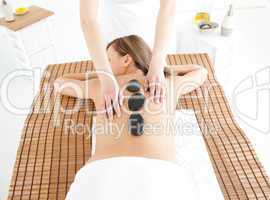 Attractive woman lying on a massage table