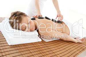 Delighted woman lying on a massage table