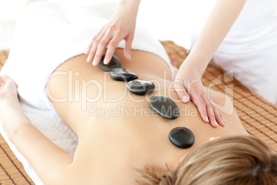 Peaceful woman having a stone therapy