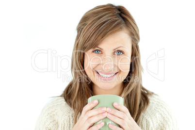 Smiling woman holding a cup a coffee