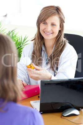 Bright female doctor holding medicine