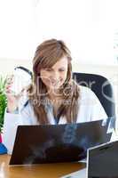 Happy female doctor looking at a radiography