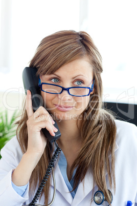 Radiant female doctor talking on the phone