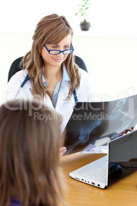 Delighted female doctor studying radiography