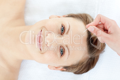 Portrait of a cheerful woman in acupuncture therapy