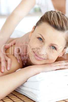 Cheerful woman enjoying a back massage