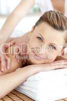 Cheerful woman enjoying a back massage