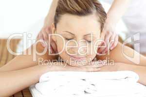 Relaxed woman enjoying a back massage