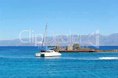 Turquoise Aegean Sea and luxury yacht, Crete, Greece