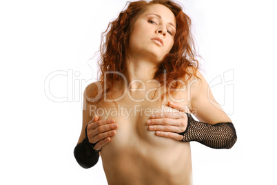 Undressing woman covering breast with hands
