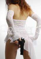 Woman in white with gun, rear view