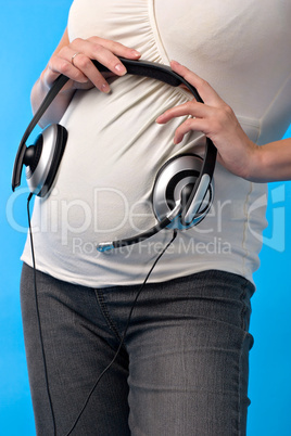 pregnant woman with headphones