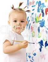 Little girl paint on a white board