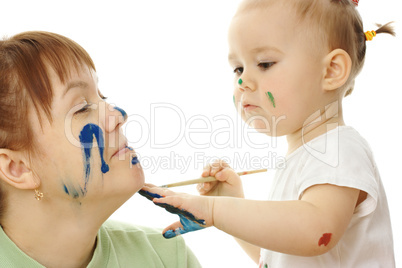 Little girl paint on her mother