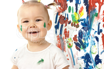 Happy little girl and her paintings