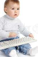 Cute child typing on a keyboard