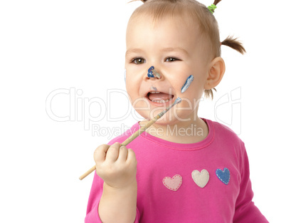 Little girl paint on her cheek