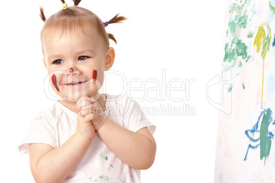 Little girl play with paints