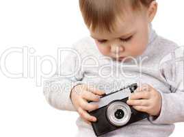 Cute child play with photocamera