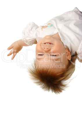 Little girl hanging upside down