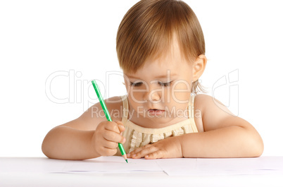 Child draw with green crayon