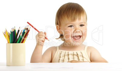 Happy child play with color pencils and smile