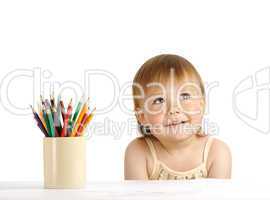 Child with bunch of color crayons