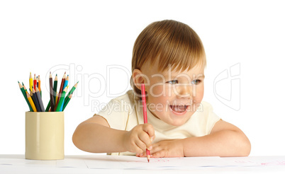Cute happy child draw with red crayon