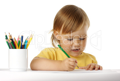 Child draw with green crayon