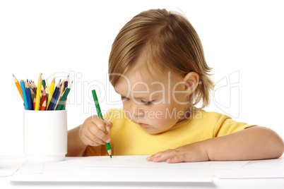 Child draw with green crayon