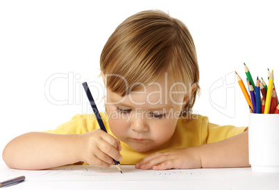 Cute child focused on drawing