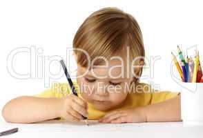 Cute child focused on drawing