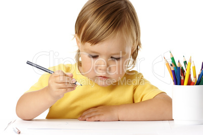 Cute child draw with color crayons