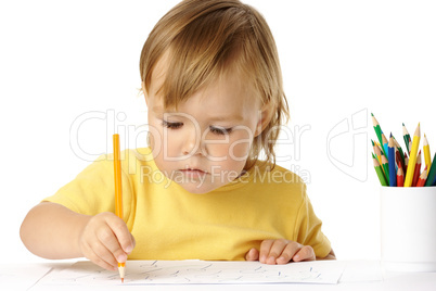 Preschooler focused on her drawing
