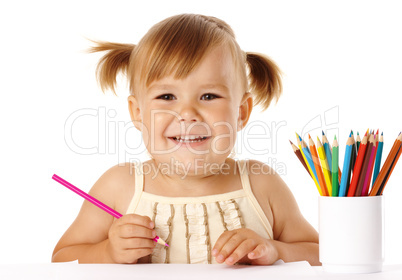 Happy child play with crayons and smile