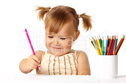Happy child play with color pencils and smile