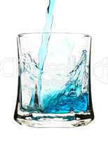 Splash, blue drink is being poured into glass