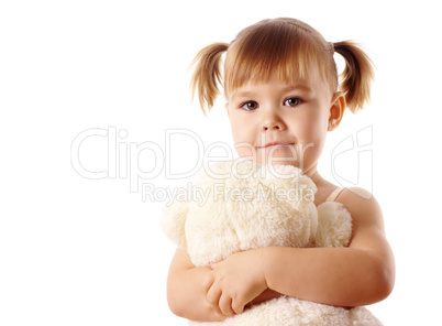 Cute girl embracing her teddy bear
