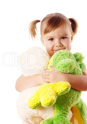 Cute girl embracing her soft toys