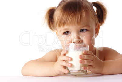 Little girl drinks milk