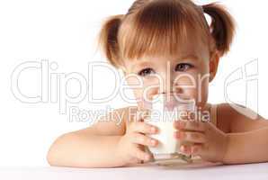 Little girl drinks milk