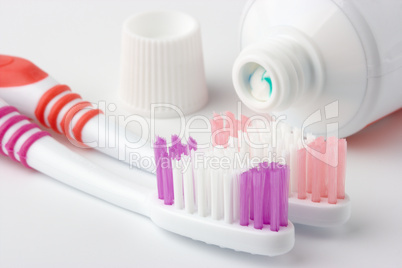 Two toothbrushes and toothpaste