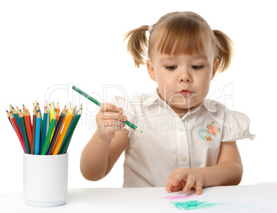 Cute child draw with color pencils