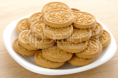 Yellow cookies on plate