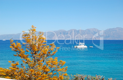 Turquoise Aegean Sea and luxury yacht, Crete, Greece